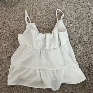 White polka dot flowy tank top. So cute on!